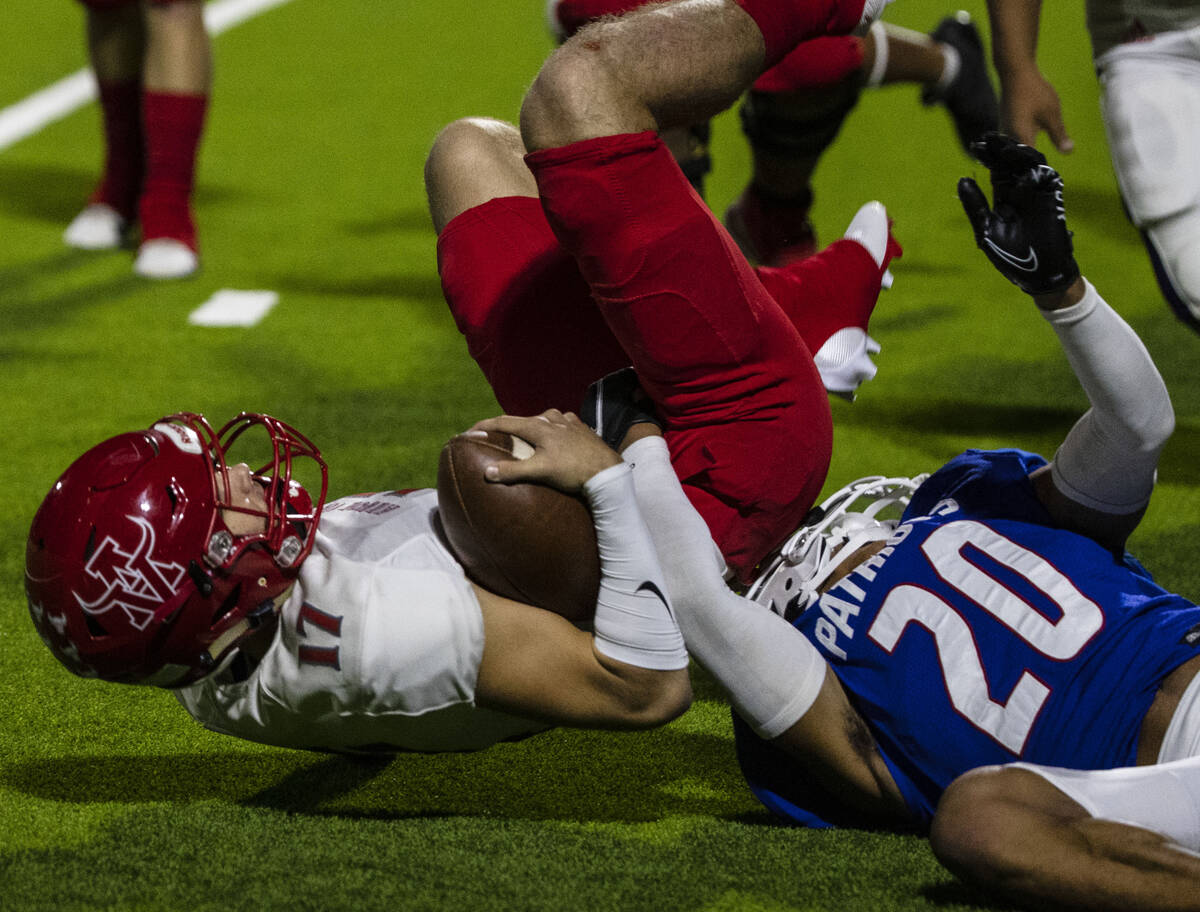 Liberty High safety Saco Alofipo (20) tackles Arbor View High quarterback Kyle Holmes (17) duri ...