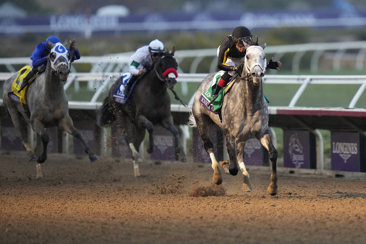 Joel Rosario rides Knicks Go, right, to victory during the Breeders' Cup Classic race at the De ...