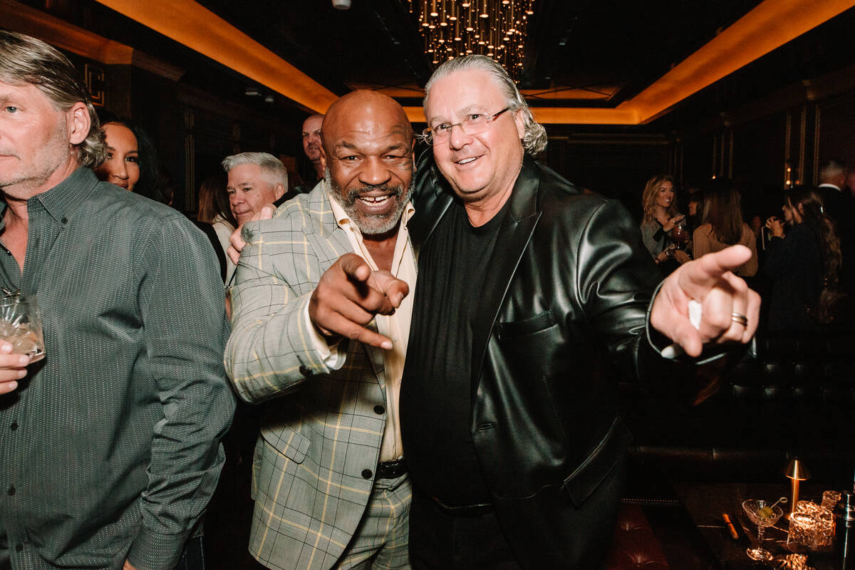 Mike Tyson and Eight Cigar Lounge partner and attorney David Chesnoff are shown at the grand op ...