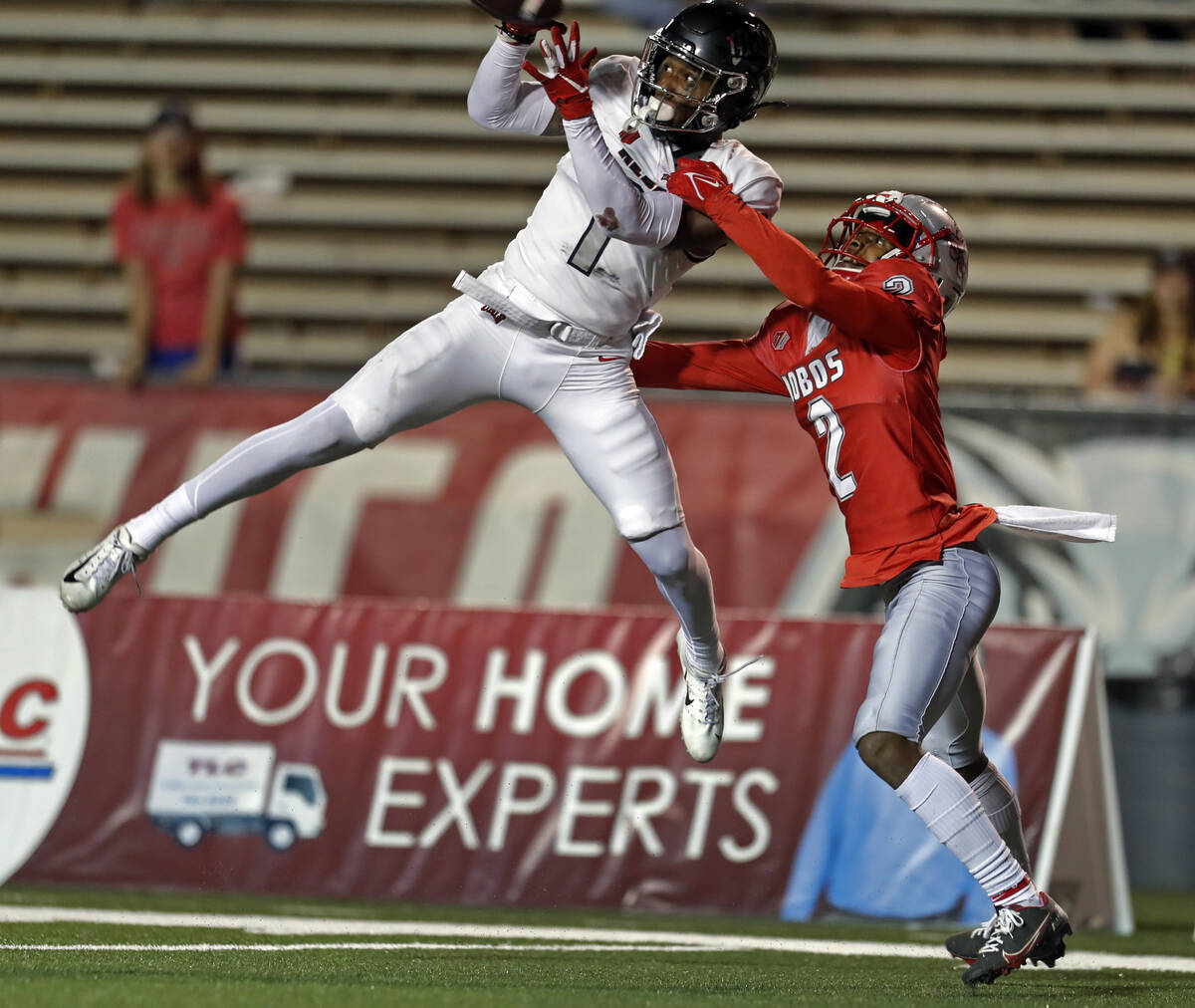 UNLV wide receiver Kyle Williams (1) catches a pass against New Mexico cornerback Tony Collier ...