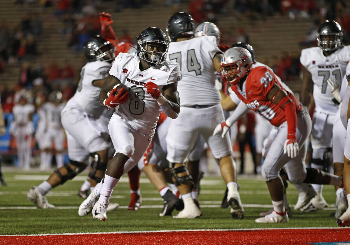 UNLV running back Charles Williams (8) sprints to the end zone for a touchdown against New Mexi ...