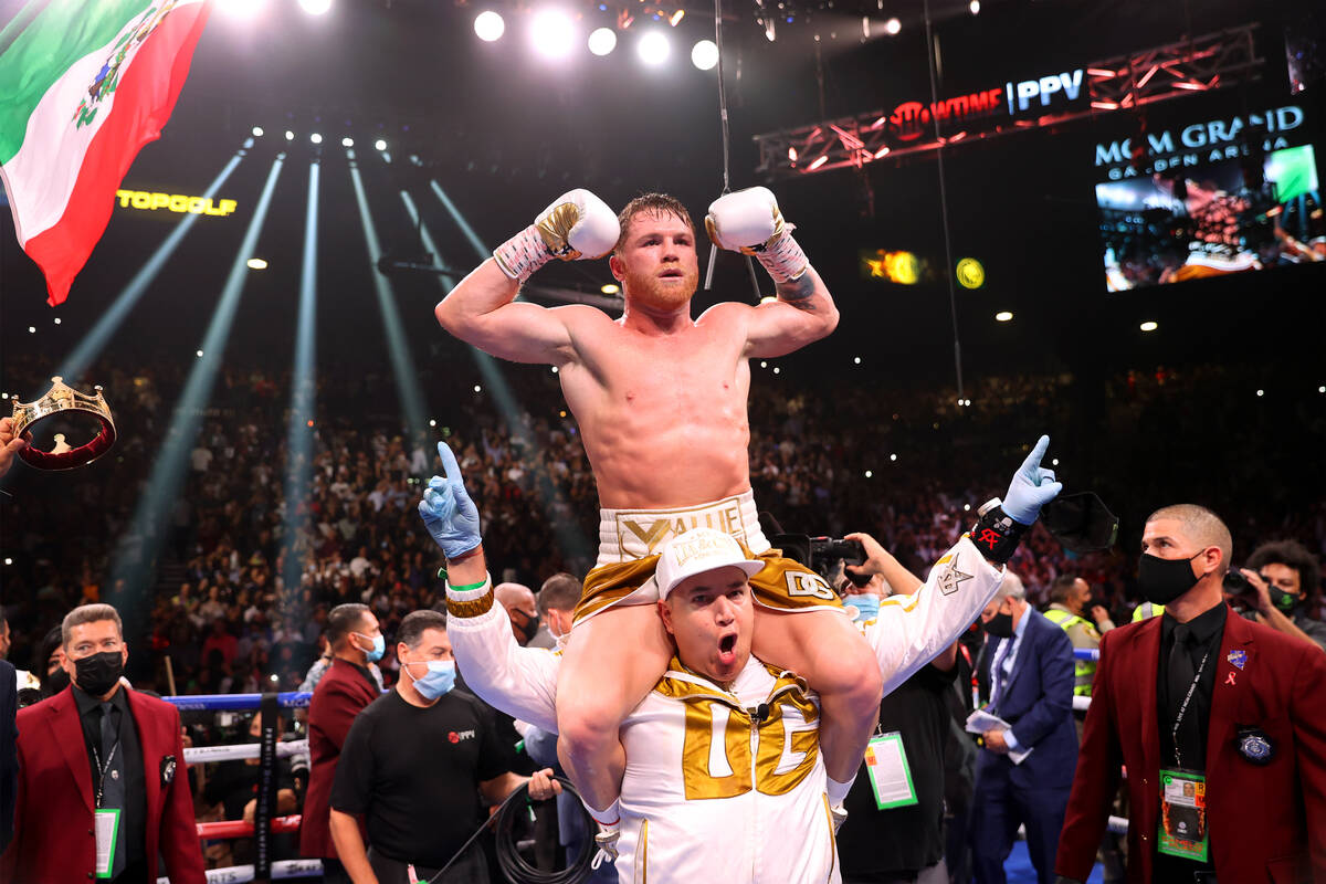 Saul “Canelo” Alvarez celebrates his 11th round knockout win against Caleb Plant ...