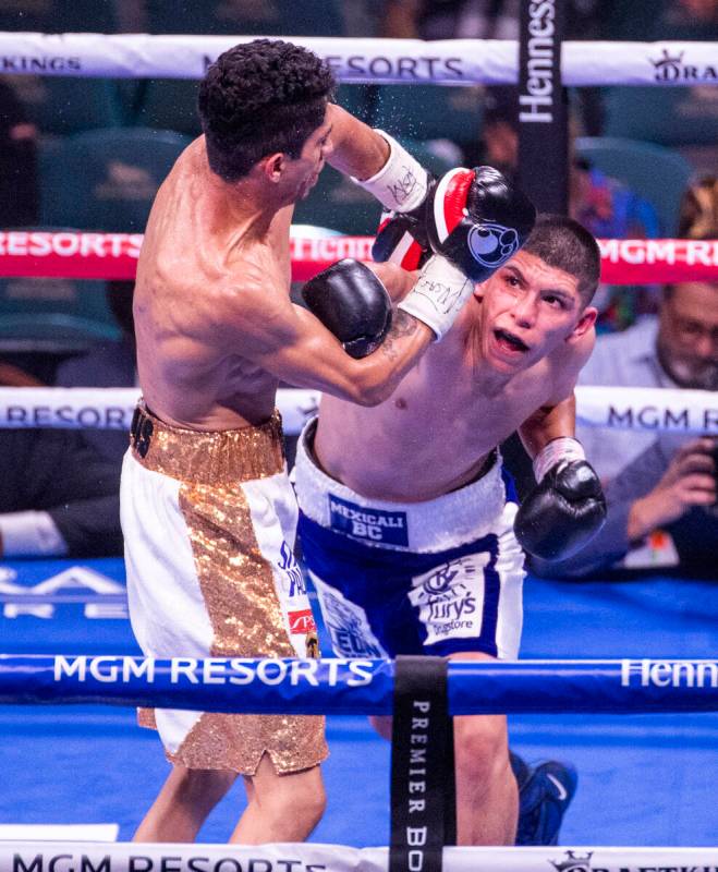 Rey Vargas and Leonardo Baez trade punches in the 4th round during their super bantamweight fig ...