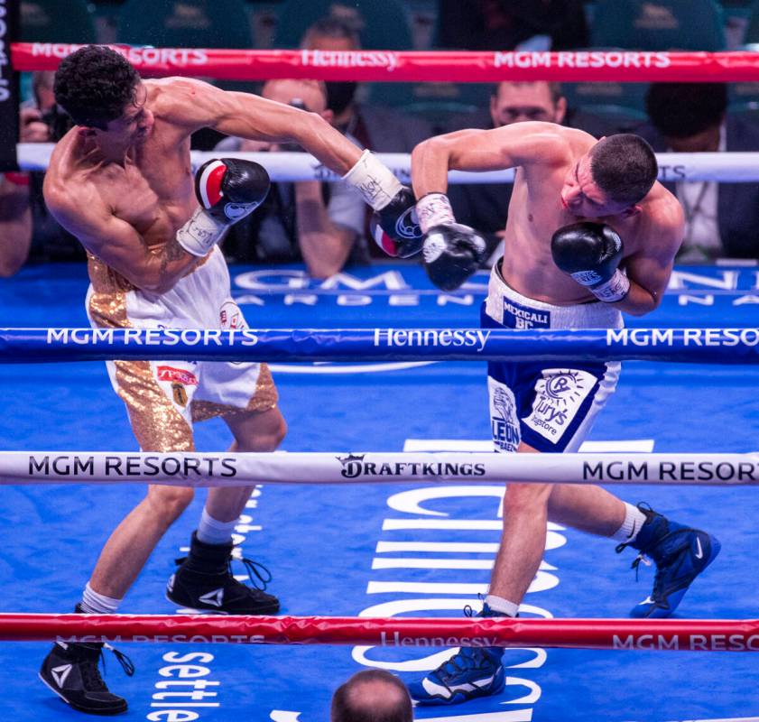 Rey Vargas and Leonardo Baez trade punches in the 5th round during their super bantamweight fig ...