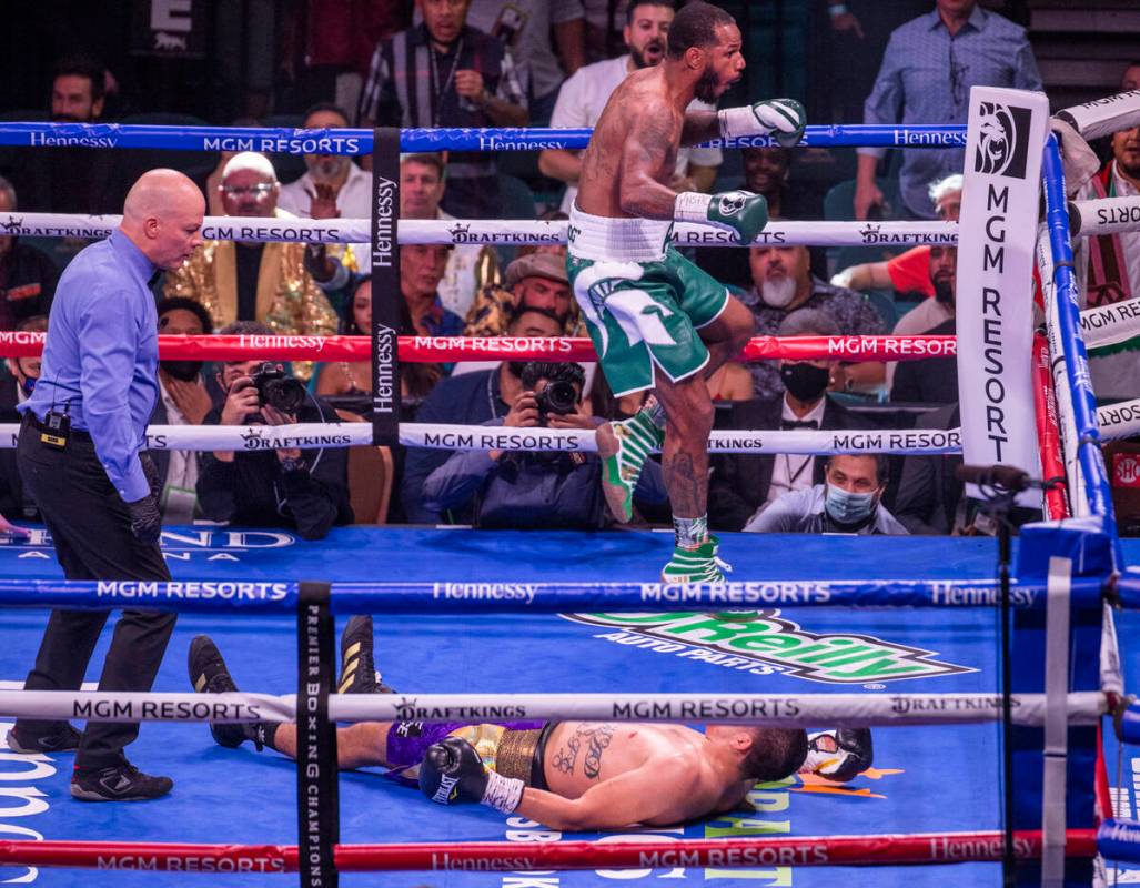 Marcos Hernandez is down on the canvas as Anthony Dirrell celebrates in the 4th round during th ...