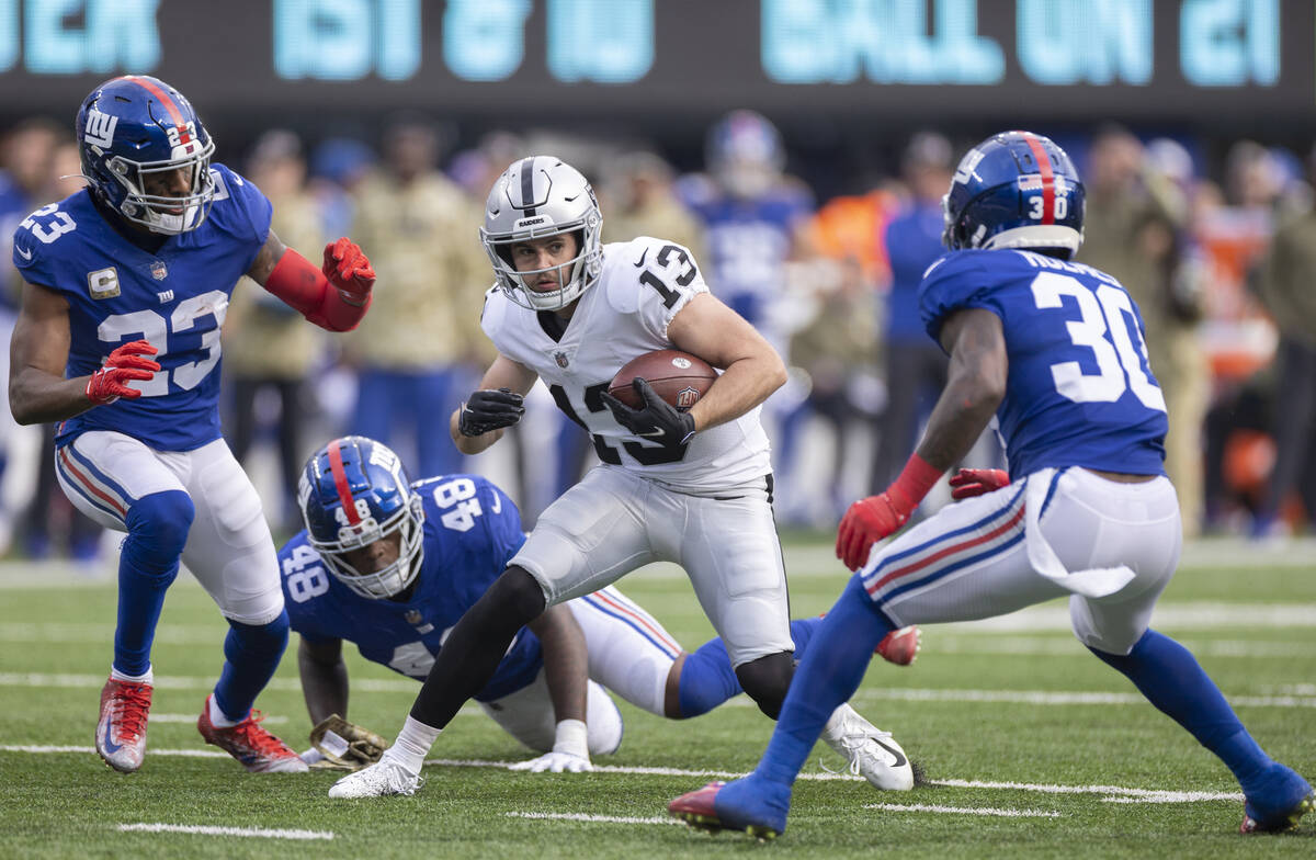 Las Vegas Raiders wide receiver Hunter Renfrow (13) splits New York Giants cornerback Darnay Ho ...