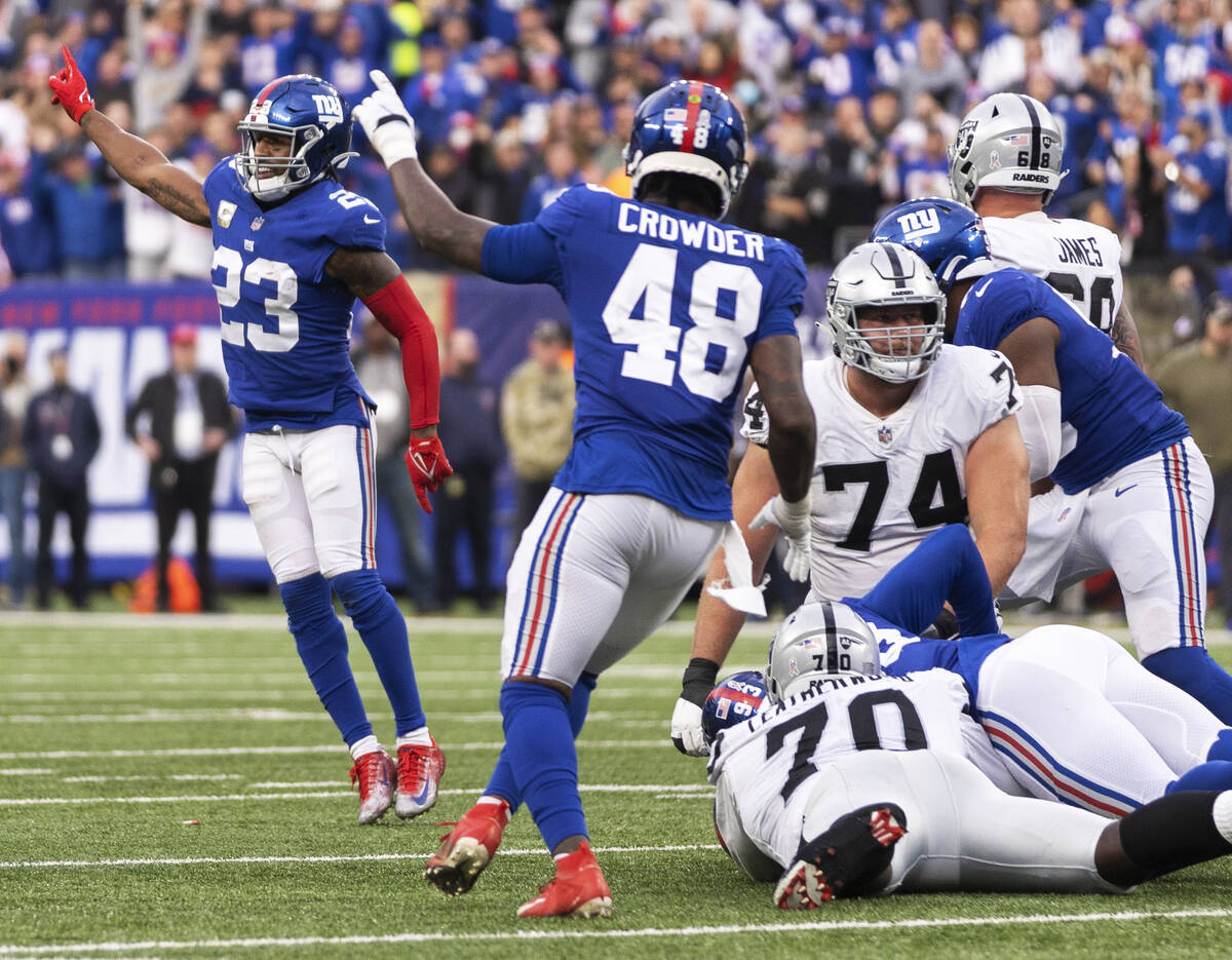 New York Giants safety Logan Ryan (23) and New York Giants linebacker Tae Crowder (48) celebrat ...