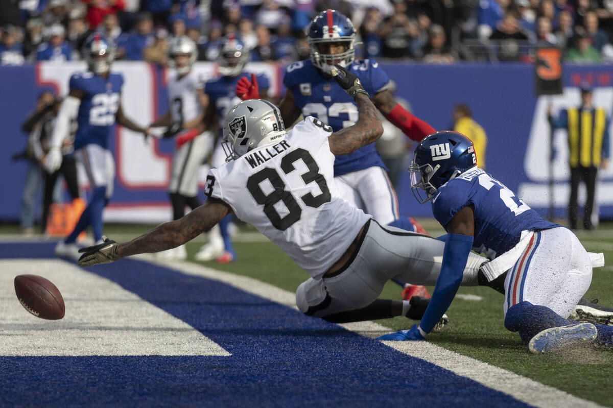 Las Vegas Raiders tight end Darren Waller (83) tries to make a catch with New York Giants corne ...
