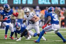 Las Vegas Raiders wide receiver Hunter Renfrow (13) splits New York Giants cornerback Darnay Ho ...