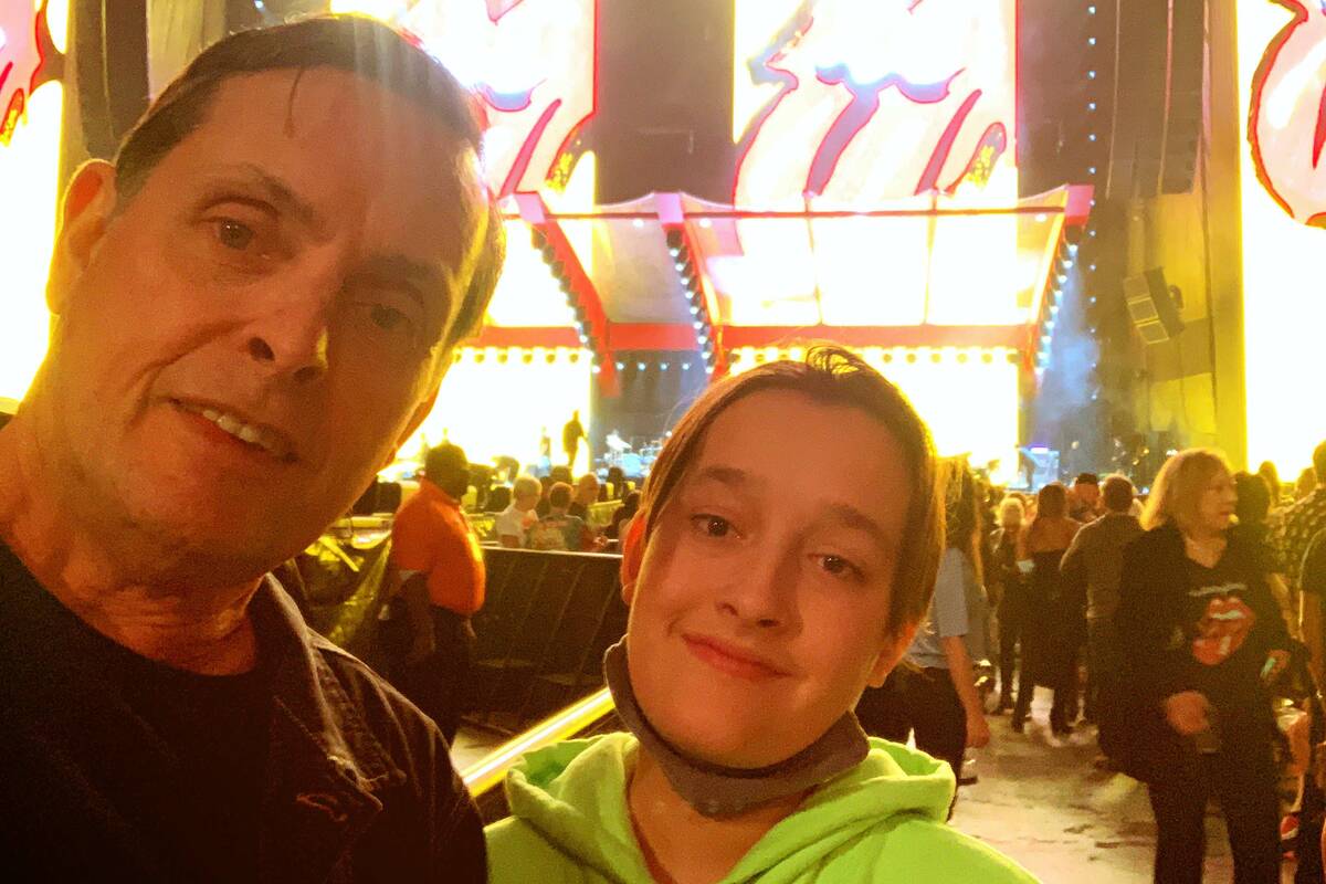 Las Vegas artist Tim Bavington and his son, Jet, are shown before at the Rolling Stones concert ...