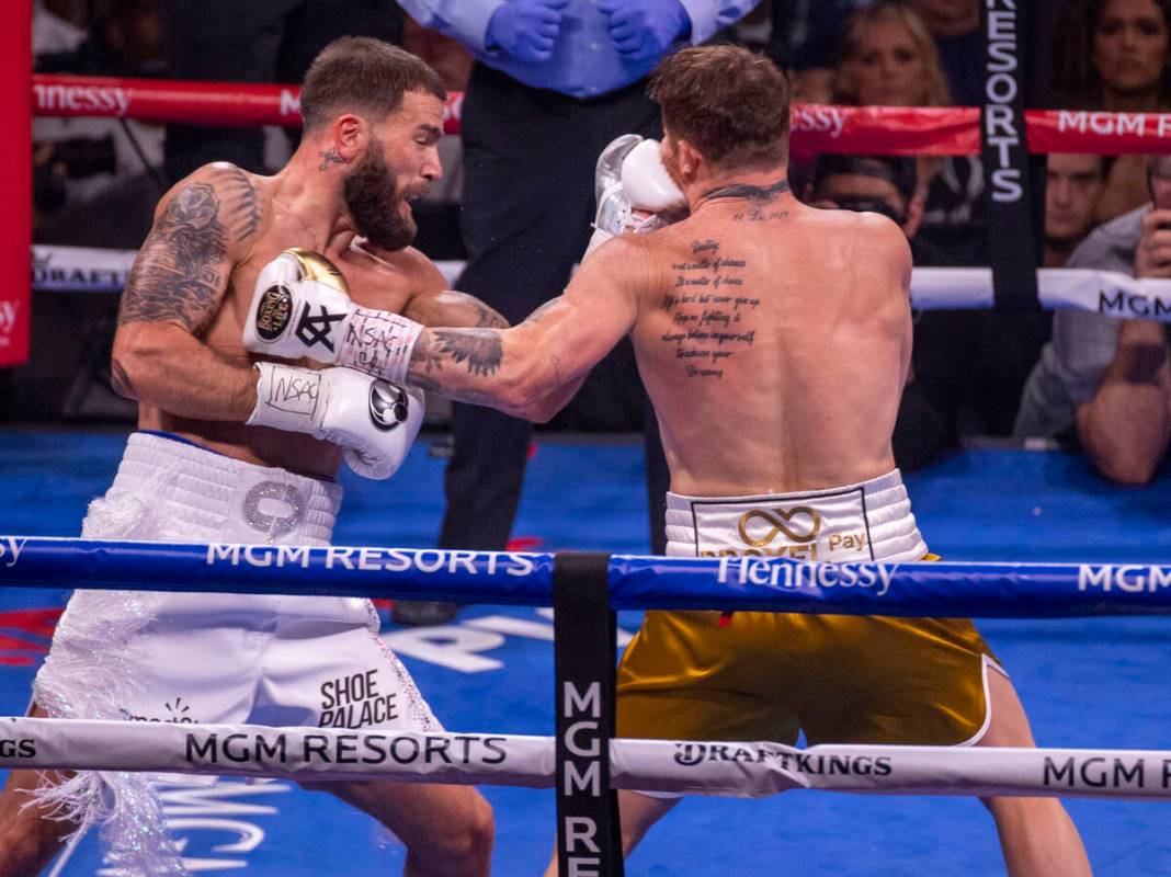 Caleb Plant connects with the chin of Saul "Canelo" Alvarez in the 1st round during t ...