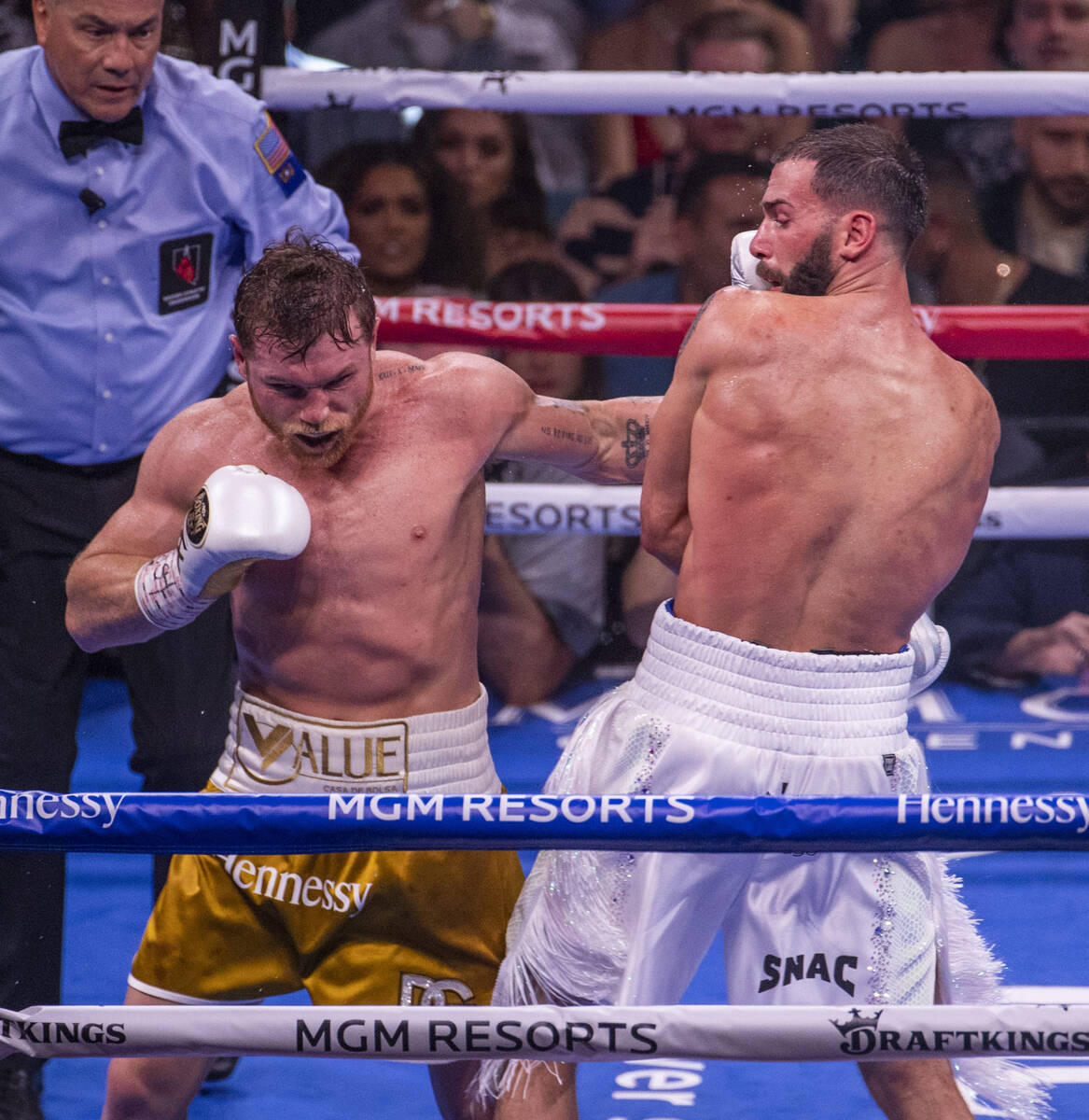 Saul "Canelo" Alvarez connects with the chin of Caleb Plant in the 6th round during t ...