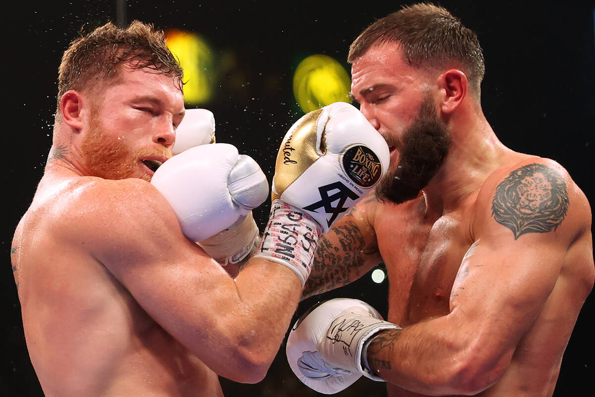 Saul “Canelo” Alvarez, left, battles Caleb Plant in the fourth round of a super m ...