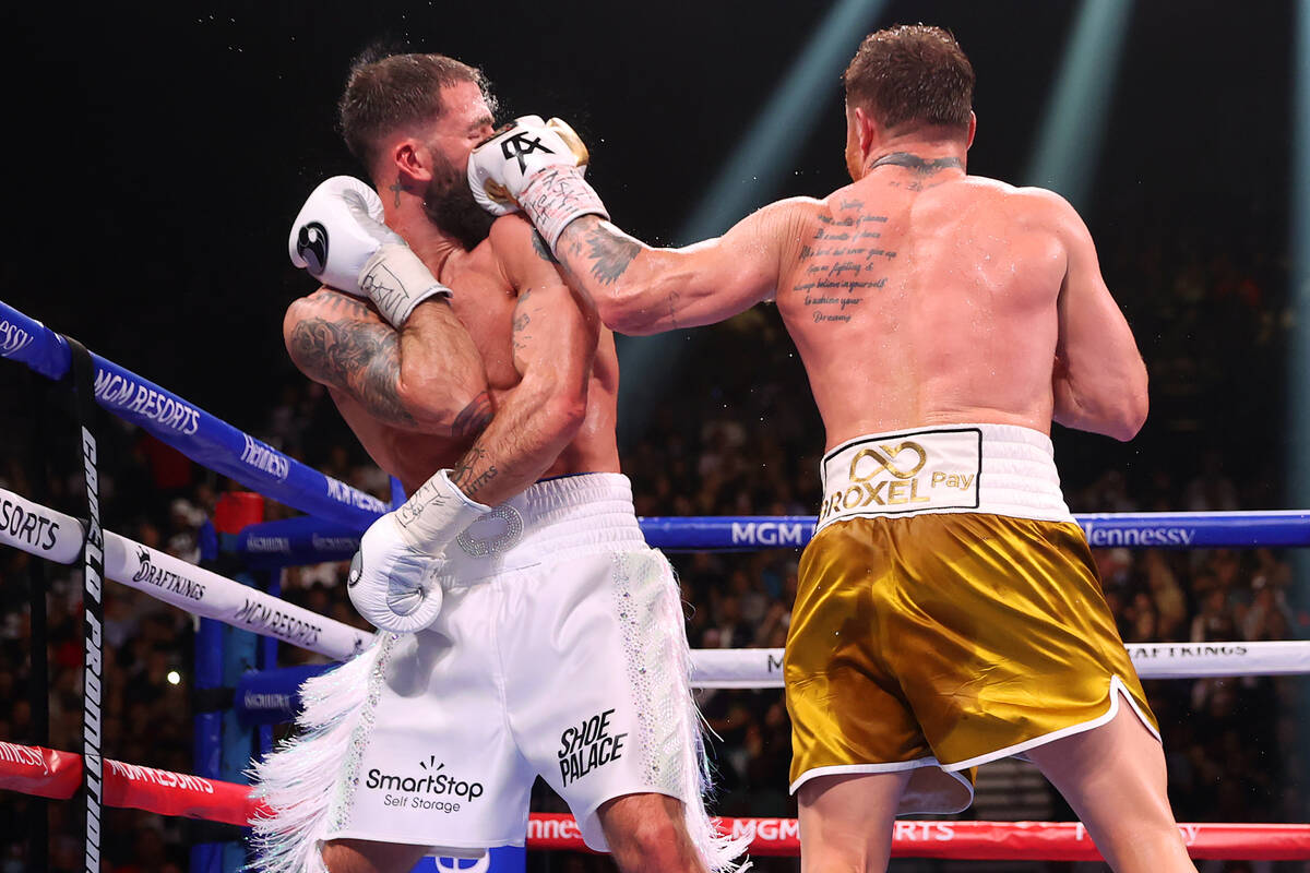 Saul “Canelo” Alvarez, right, connects a punch against Caleb Plant in the 11th ro ...