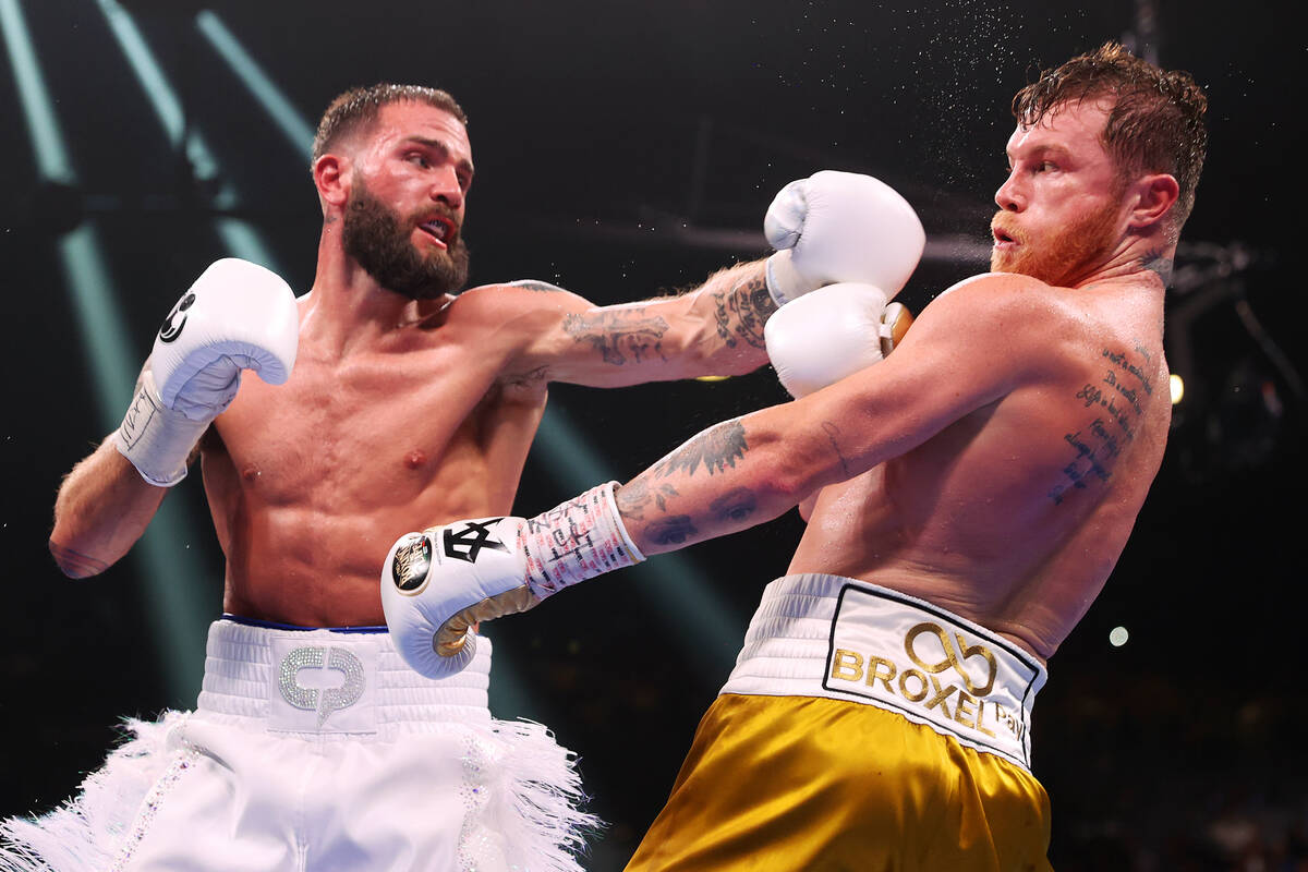 Saul “Canelo” Alvarez, right, dodges a punch from Caleb Plant in the eight round ...