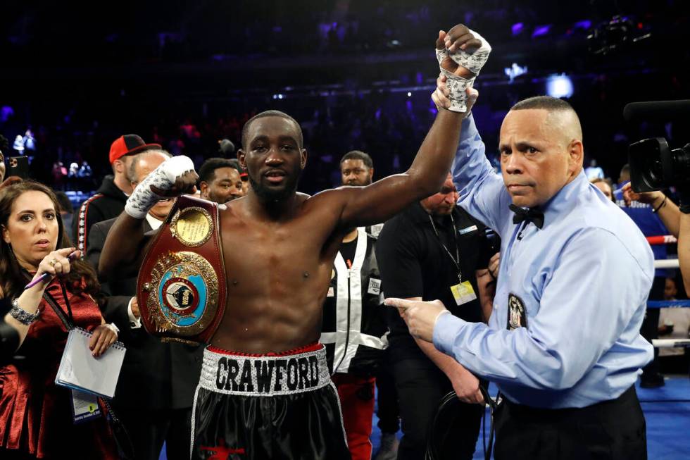 In this Saturday, Dec. 14, 2019 file photo, Terence Crawford has his hand raised in victory aft ...