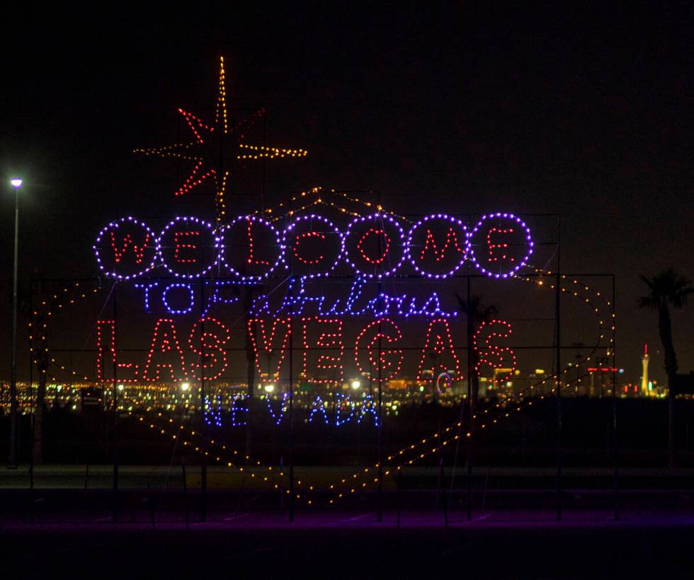 A light display of the Fabulous Las Vegas Sign is seen during a tour of the Glittering Lights a ...