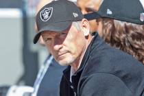 Raiders general manager Mike Mayock watches warm ups from the bench before an NFL football game ...