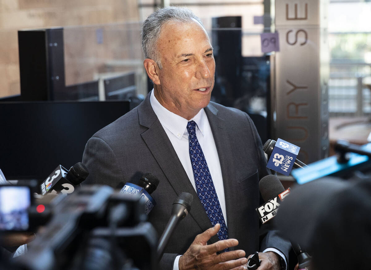 Clark County District Attorney Steve Wolfson addresses the news media after a status hearing in ...