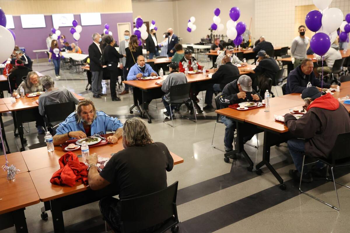People dine during the reopening event of the St. Vincent Lied Dining Facility at the Catholic ...