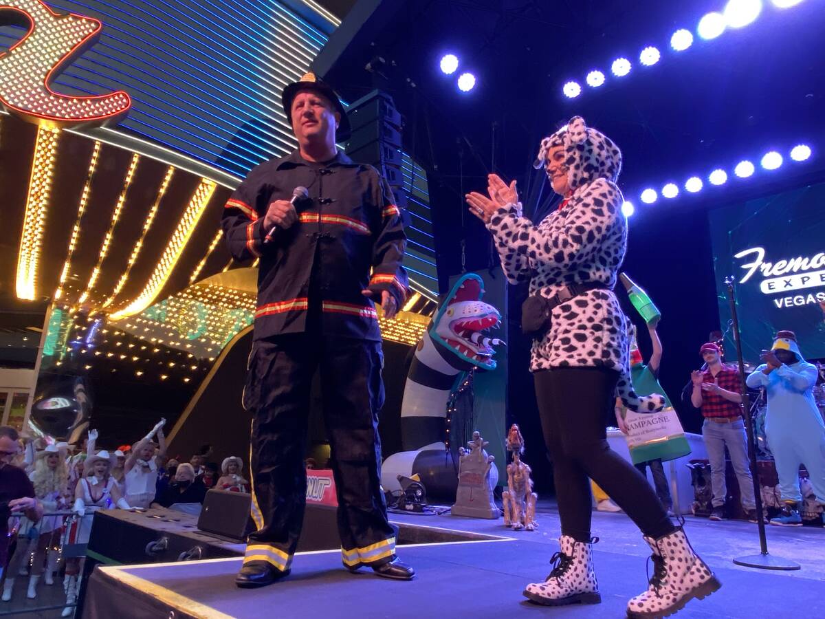 Derek and Nicole Stevens are shown on 1st Street Stage on Fremont Street, in front of the ​Ci ...