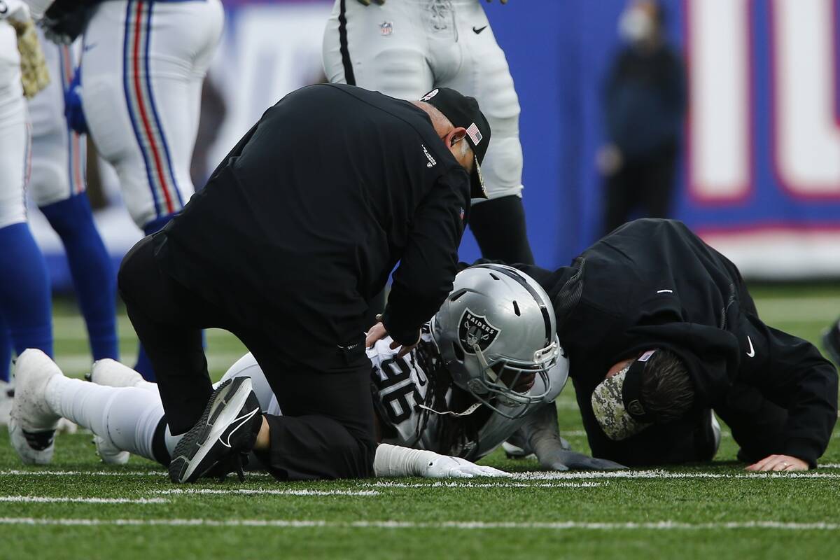 Trainers check on Las Vegas Raiders' Darius Philon after he was injured during the second half ...