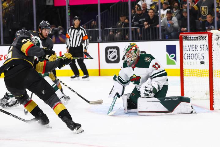 Golden Knights right wing Jonas Rondbjerg (46) scores a goal past Minnesota Wild goaltender Cam ...