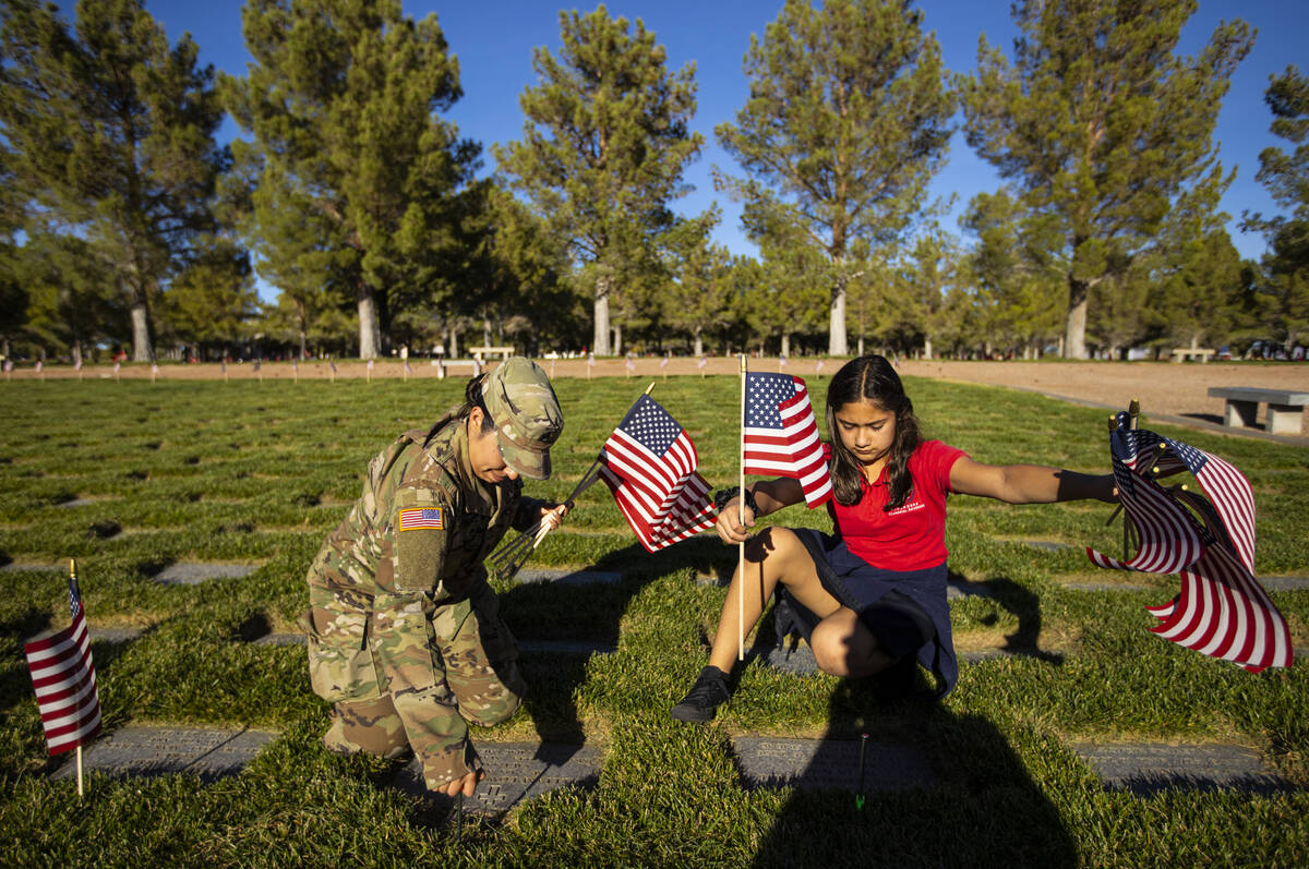 Nevada Army National Guard SSgt. Yvette Hernandez, left, and her daughter, Jasmine Flores, 10, ...