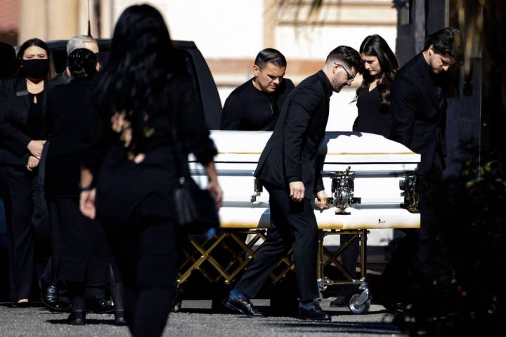 Pallbearers carry the casket of Tina Tintor, killed in a crash with then-Raiders wide receiver ...