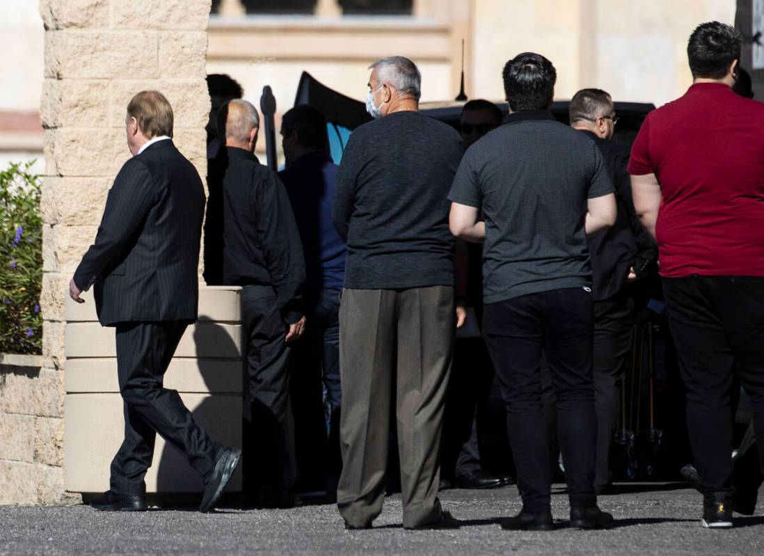 Raiders owner Mark Davis, left, leaves St. Simeon Serbian Orthodox Church after attending Tina ...