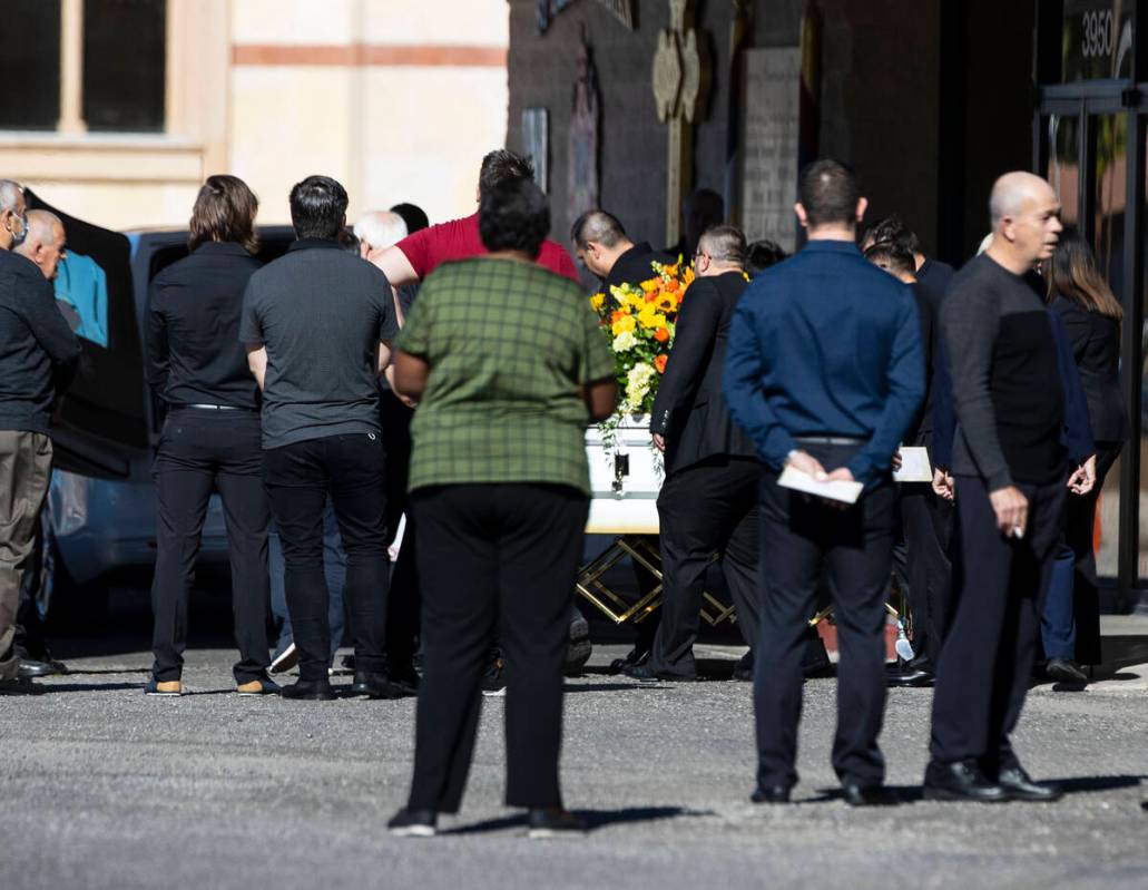 Pallbearers carry the casket of Tina Tintor, killed in a crash with then-Raiders wide receiver ...