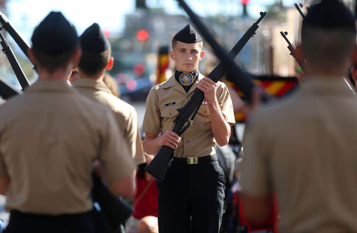 The Centennial High School's junior ROTC participate during the Veterans Day parade on 4th Stre ...