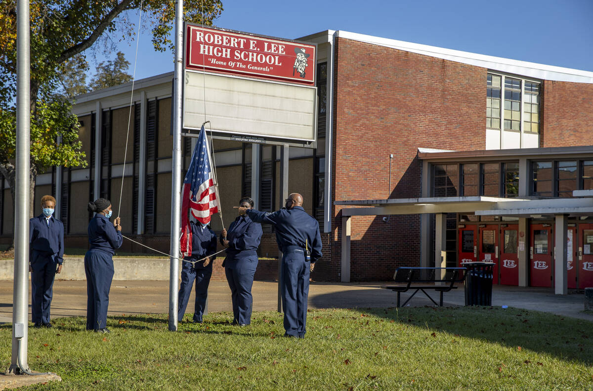 ROTC members raise the flag at Robert E. Lee High School where Henry Ruggs attended and excelle ...