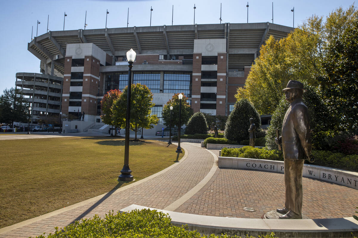 Bryant-Denny Stadium, home of the University of Alabama football team, and a statue of legendar ...