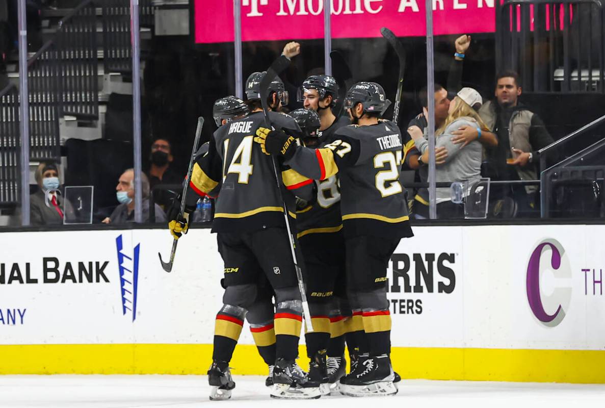 The Golden Knights celebrate a goal by Golden Knights center Jonathan Marchessault, obscured, d ...