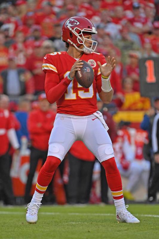 Kansas City Chiefs quarterback Patrick Mahomes (15) drops back during an NFL football game agai ...