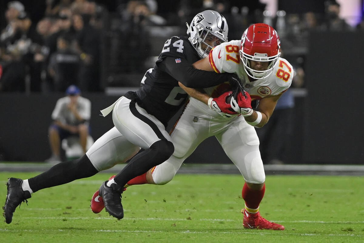 Las Vegas Raiders safety Johnathan Abram (24) tackles Kansas City Chiefs tight end Travis Kelce ...