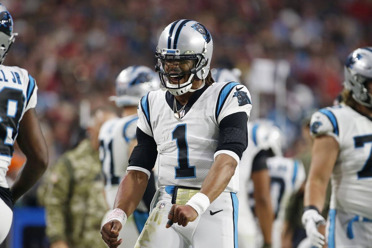 Carolina Panthers quarterback Cam Newton celebrates after a Panthers touchdown against the Ariz ...