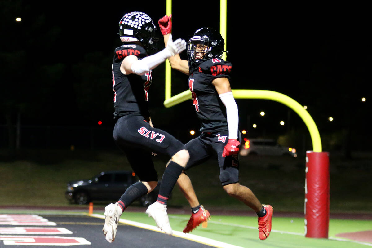 Las Vegas' Andrew Bowen (12) celebrates his touchdown with Alvaro Zentino (4) in the first half ...