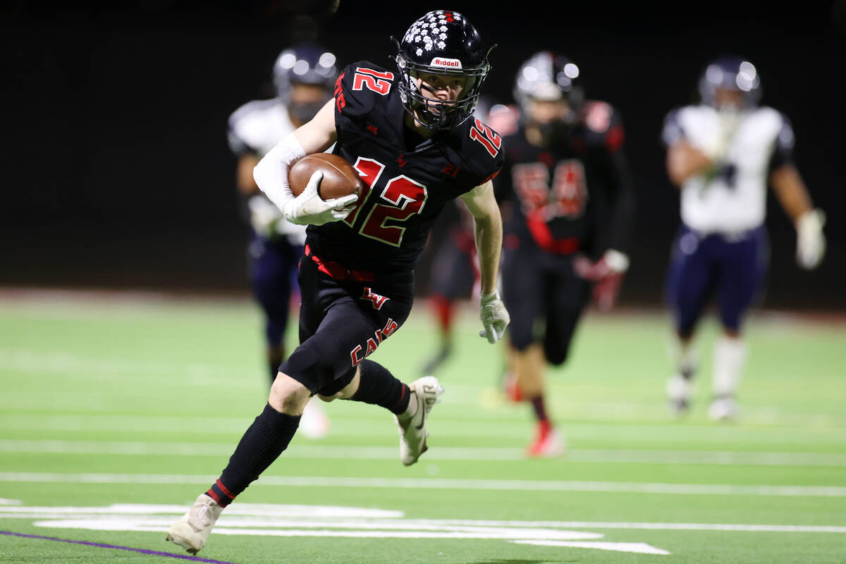 Las Vegas' Andrew Bowen (12) runs the ball for a touchdown against Shadow Ridge in the first ha ...