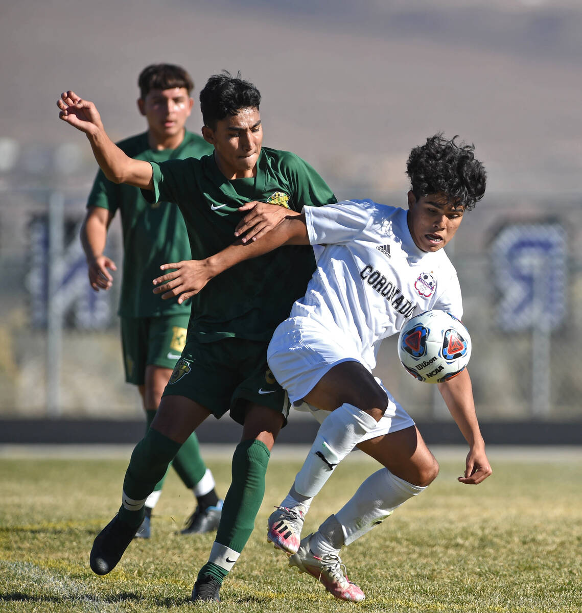 Coronado's Francisco Avila looks to take control of ball over Hug's Alan Gutierrez during Frida ...