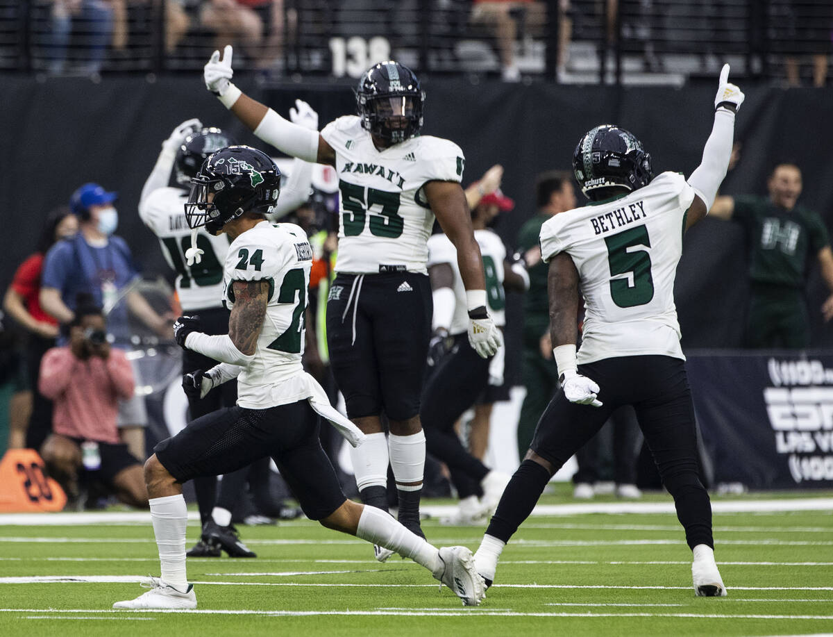 Hawaii Warriors players celebrate after wide receiver Nick Mardner (84) intercepted the ball du ...