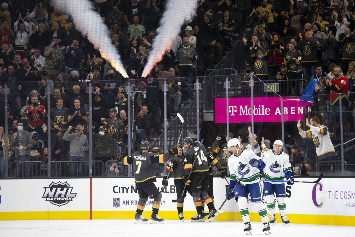 The Golden Knights celebrate after right wing Reilly Smith (19) scored a goal during the second ...