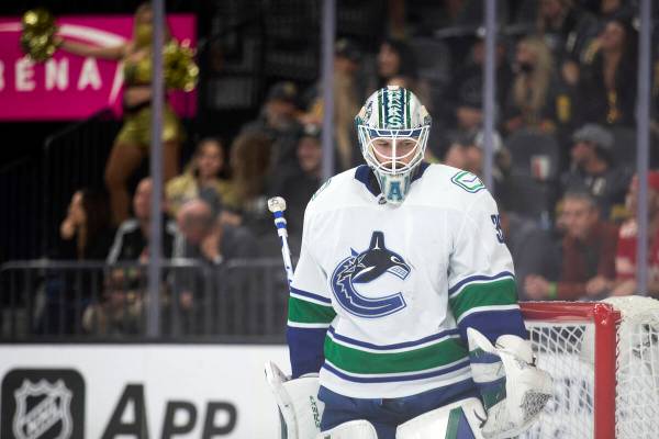 Canucks goaltender Thatcher Demko (35) minds the goal after the Golden Knights scored during th ...
