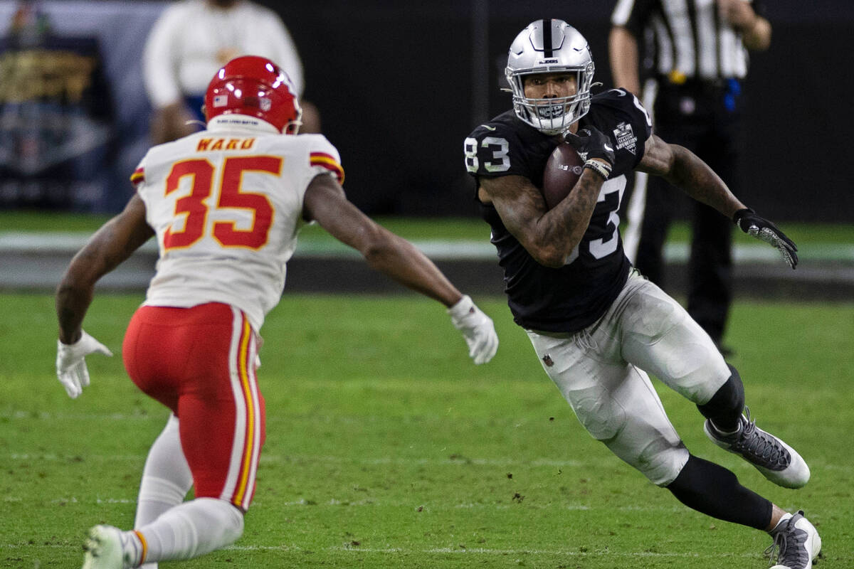 Las Vegas Raiders tight end Darren Waller (83) makes a move on Kansas City Chiefs cornerback Ch ...