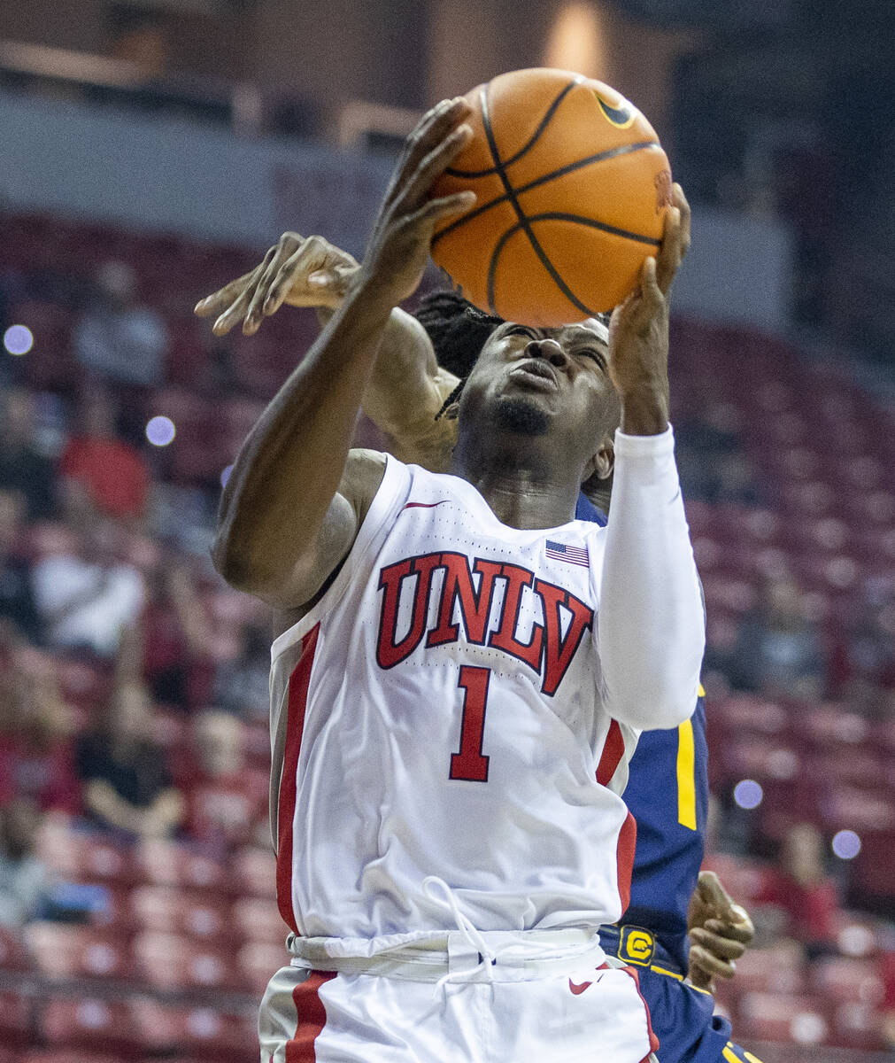 UNLV Rebels guard Mike Nuga (1) gets inside for a score over the California Golden Bears during ...