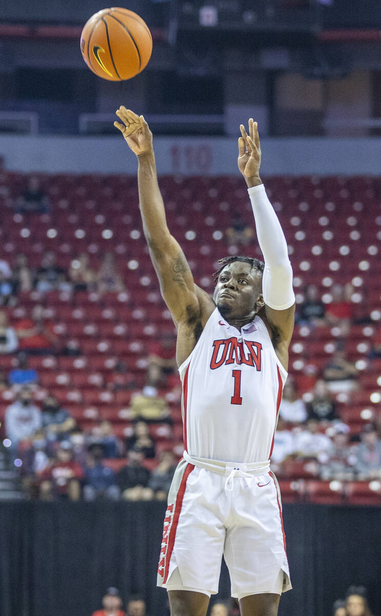 UNLV Rebels guard Mike Nuga (1) lets go another three-point attempt versus the California Golde ...