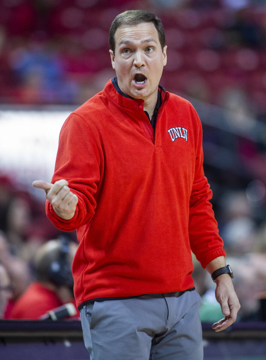 UNLV Rebels head coach Kevin Kruger yells instructions to players on the court versus the Calif ...