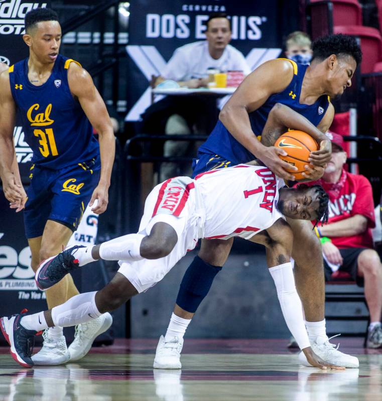 UNLV Rebels guard Mike Nuga (1) fights for a loose ball with California Golden Bears forward Mo ...