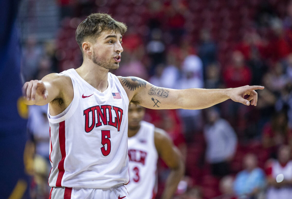 UNLV Rebels guard Jordan McCabe (5) directs his teammates after a foul for critical free throws ...
